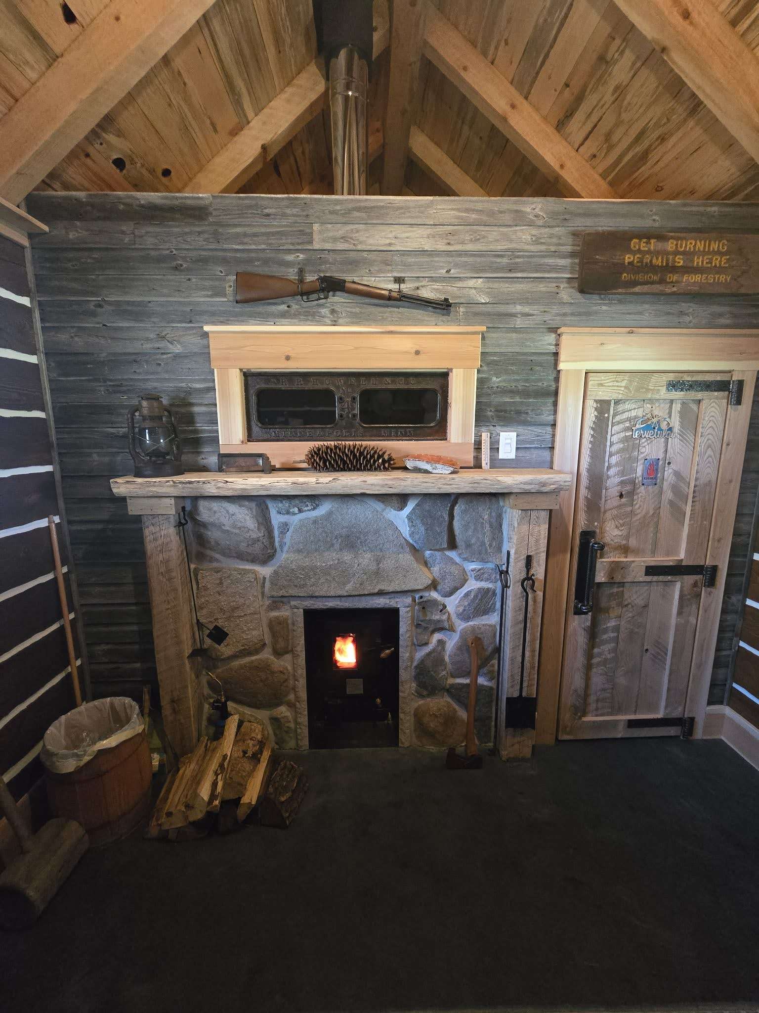 The stonework and wood interior give the sauna a warm, handcrafted feel.